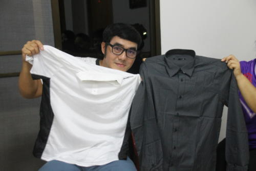 Asanee with 2 new shirts – 1 white and 1 black.