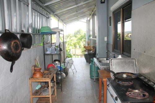Outside kitchen, stove and pots and pans