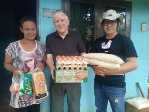 Lek, Bill & Asanee delivering food to Lek and her family.